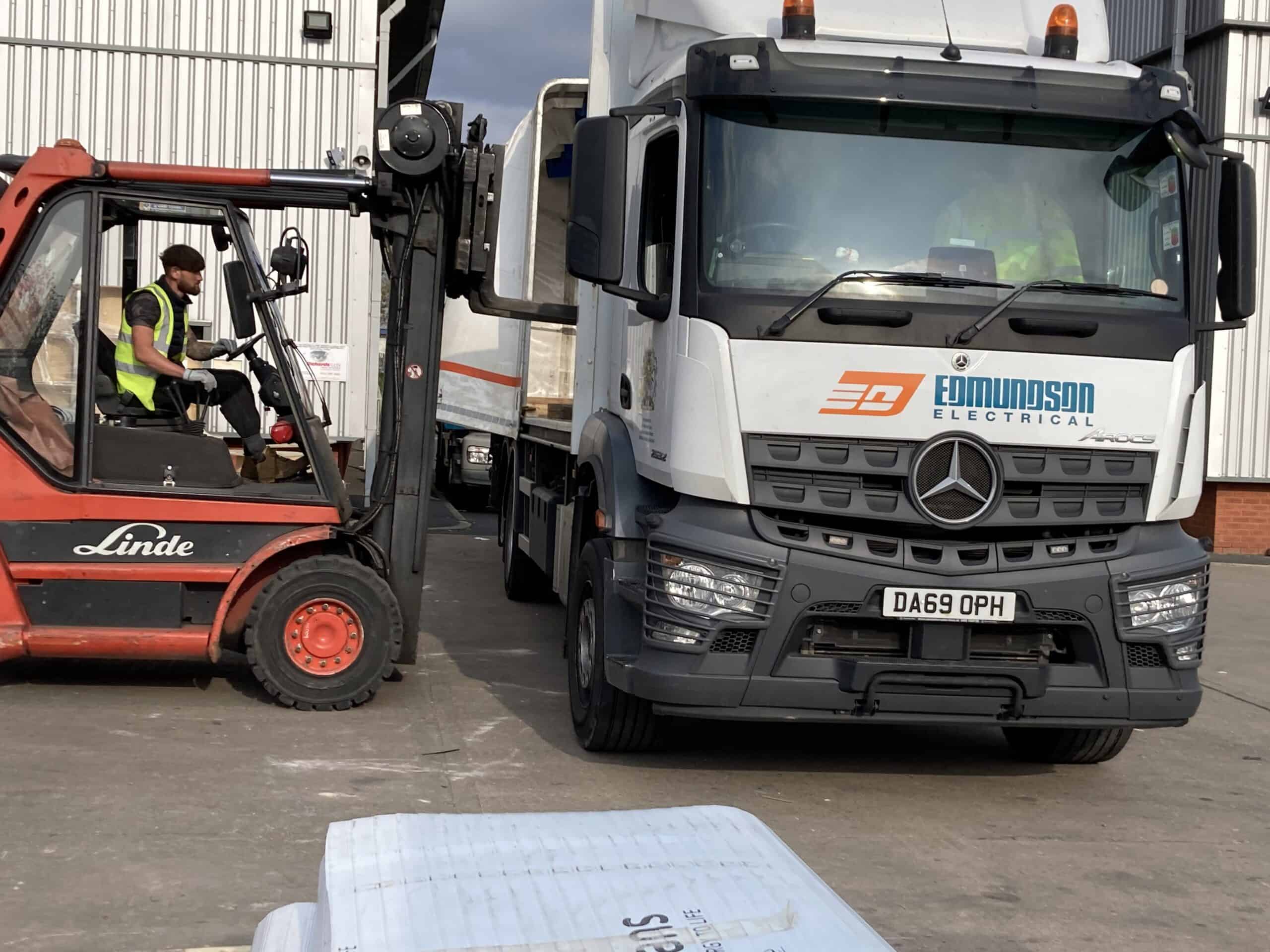 An image of a lorry and a forklift truck demonstrating safety process in a training video.